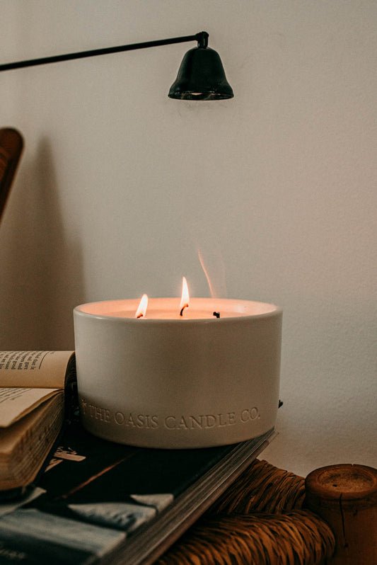 A Cassis and Fig scented candle from home fragrance brand, The Oasis Candle Co