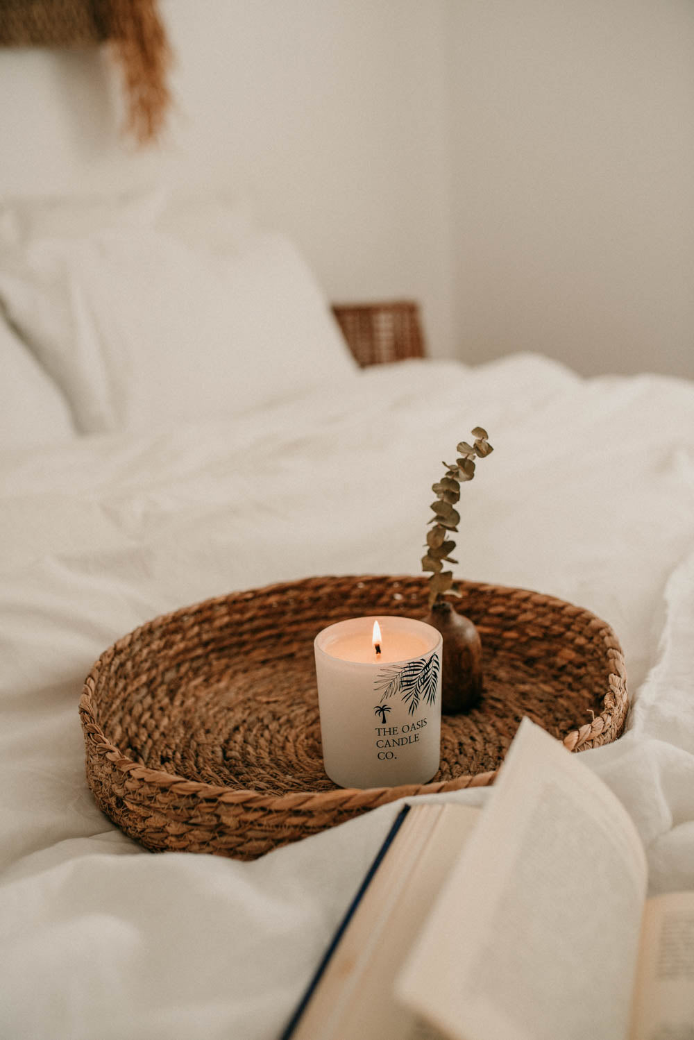 A Tonka and Myrrh scented candle from home fragrance brand, The Oasis Candle Co