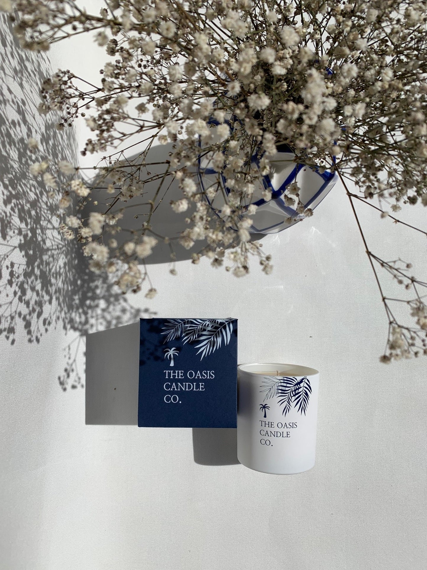 A Cassis and Fig scented candle from home fragrance brand, The Oasis Candle Co