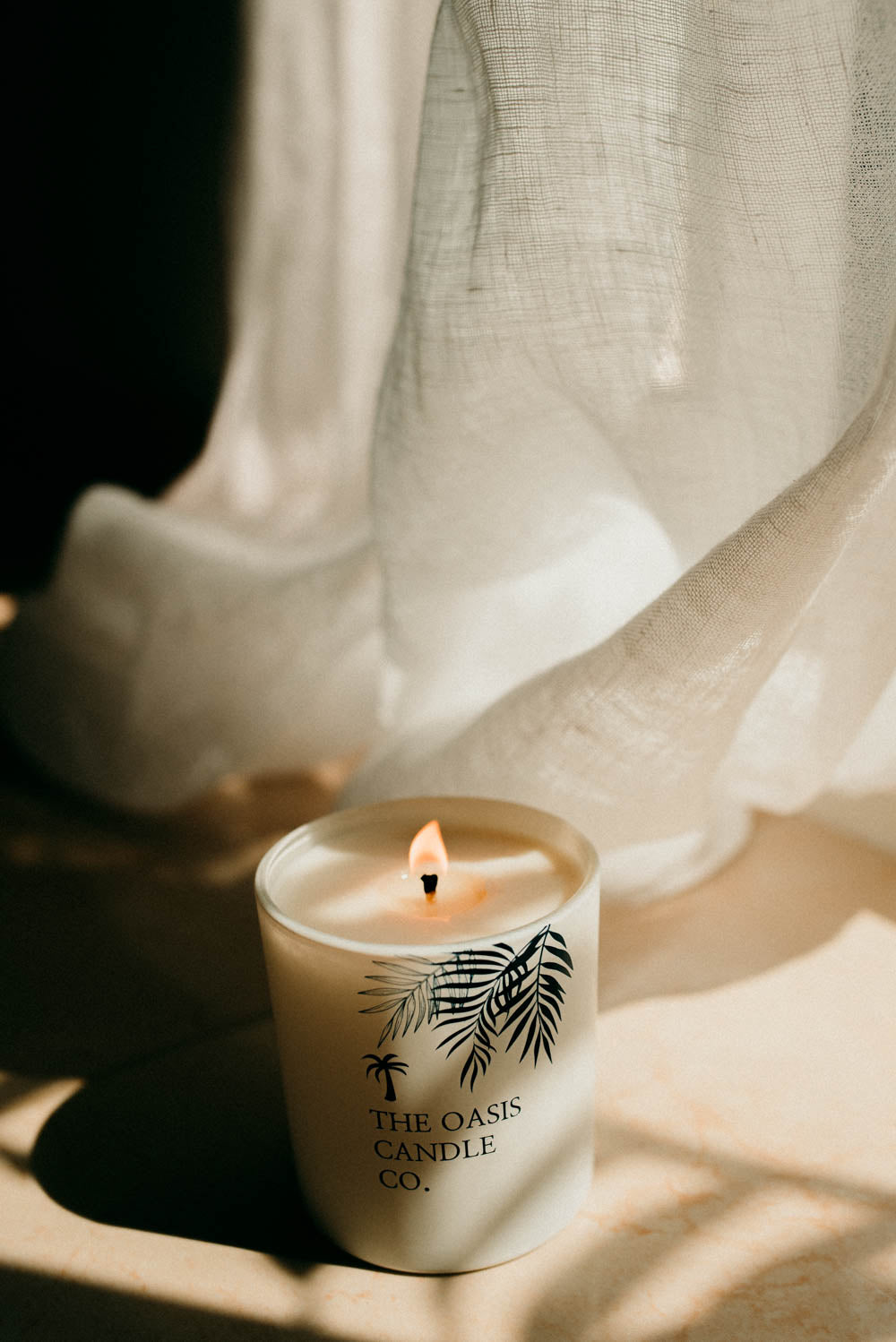 A Peony and Blush Suede candle from The Oasis Candle Co collection of scented candles online