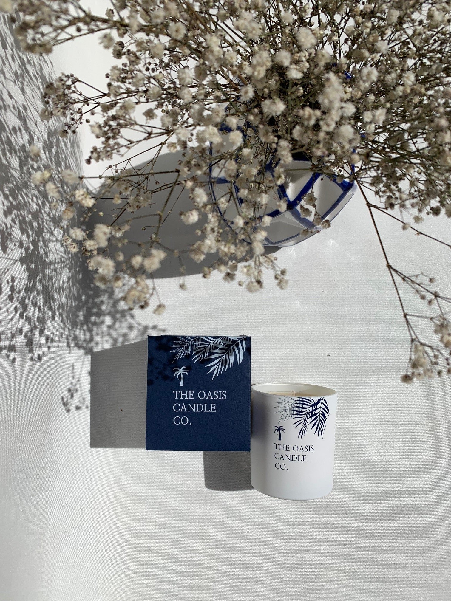 A Tonka and Myrrh scented candle from home fragrance brand, The Oasis Candle Co