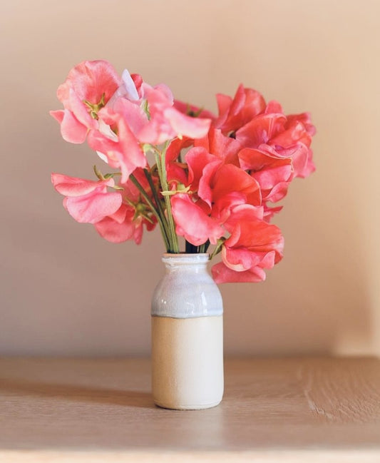 A Glosters milk bottle vase from The Oasis Candle Co