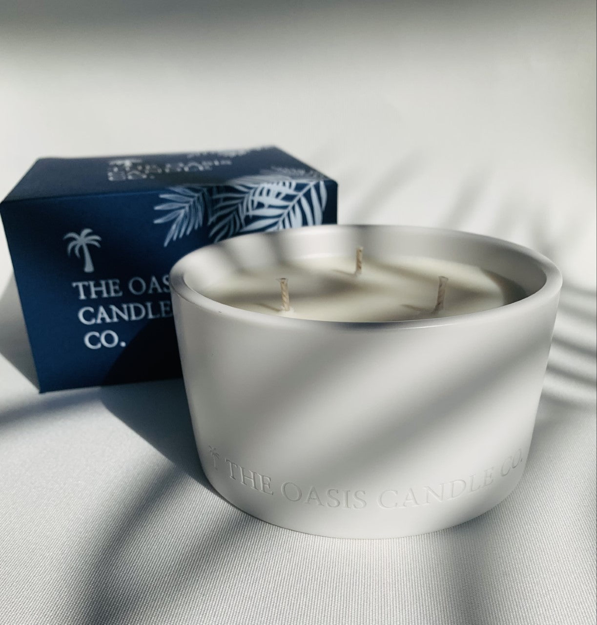 An Alfresco Muddled Mint and Lime scented candle from home fragrance brand, The Oasis Candle Co